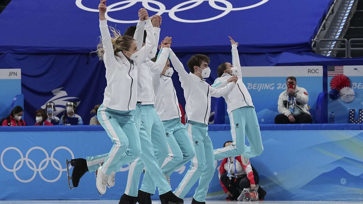 Gold medalists team from the Russian Olympic Committee celebrates following the victory ceremony after the team event in the figure skating competition at the 2022 Winter Olympics, Monday, Feb. 7, 2022, in Beijing.