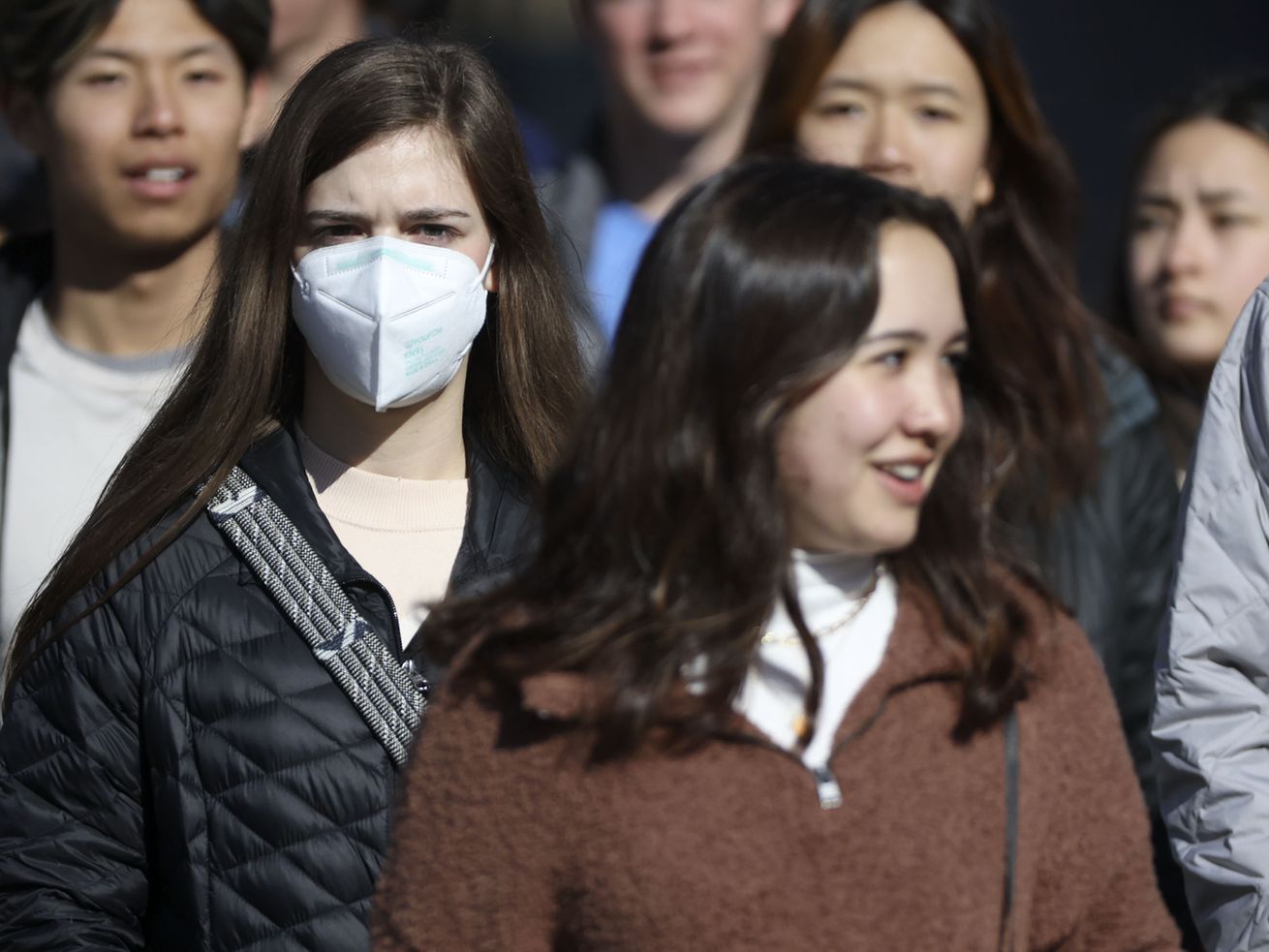 A young woman wears a KN95 mask in downtown Salt Lake City on Wednesday, Jan. 26. A new poll shows Utahns are divided over the value of masks during this stage of the pandemic.