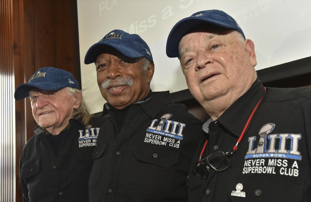 Members of the Never Miss a Super Bowl Club, from the left, Tom Henschel, Gregory Eaton, and Don Crisman pose for a group photograph during a welcome luncheon, in Atlanta, Feb. 1, 2019. They're meeting at the Super Bowl once again for this year's game, but future meetings are in question.