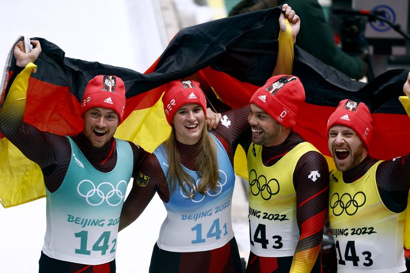 2022 Beijing Olympics - Luge - Team Relay Competition - National Sliding Centre, Beijing, China - February 10, 2022. Natalie Geisenberger of Germany, Johannes Ludwig of Germany,Tobias Wendl of Germany and Tobias Arlt of Germany celebrate after winning gold.