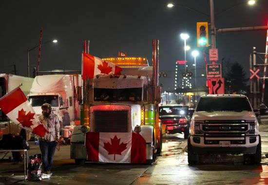 Truckers and supporters block access leading from the Ambassador Bridge, linking Detroit and Windsor, to protest against the COVID-19 vaccine mandates and restrictions in Windsor, Ontario, Canada, on Wednesday.