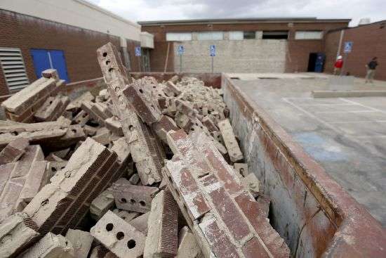 Bricks that fell off a wall at Cyprus High School during a 5.7 magnitude earthquake and its aftershocks are pictured in a dumpster at the Magna school on April 6, 2020.