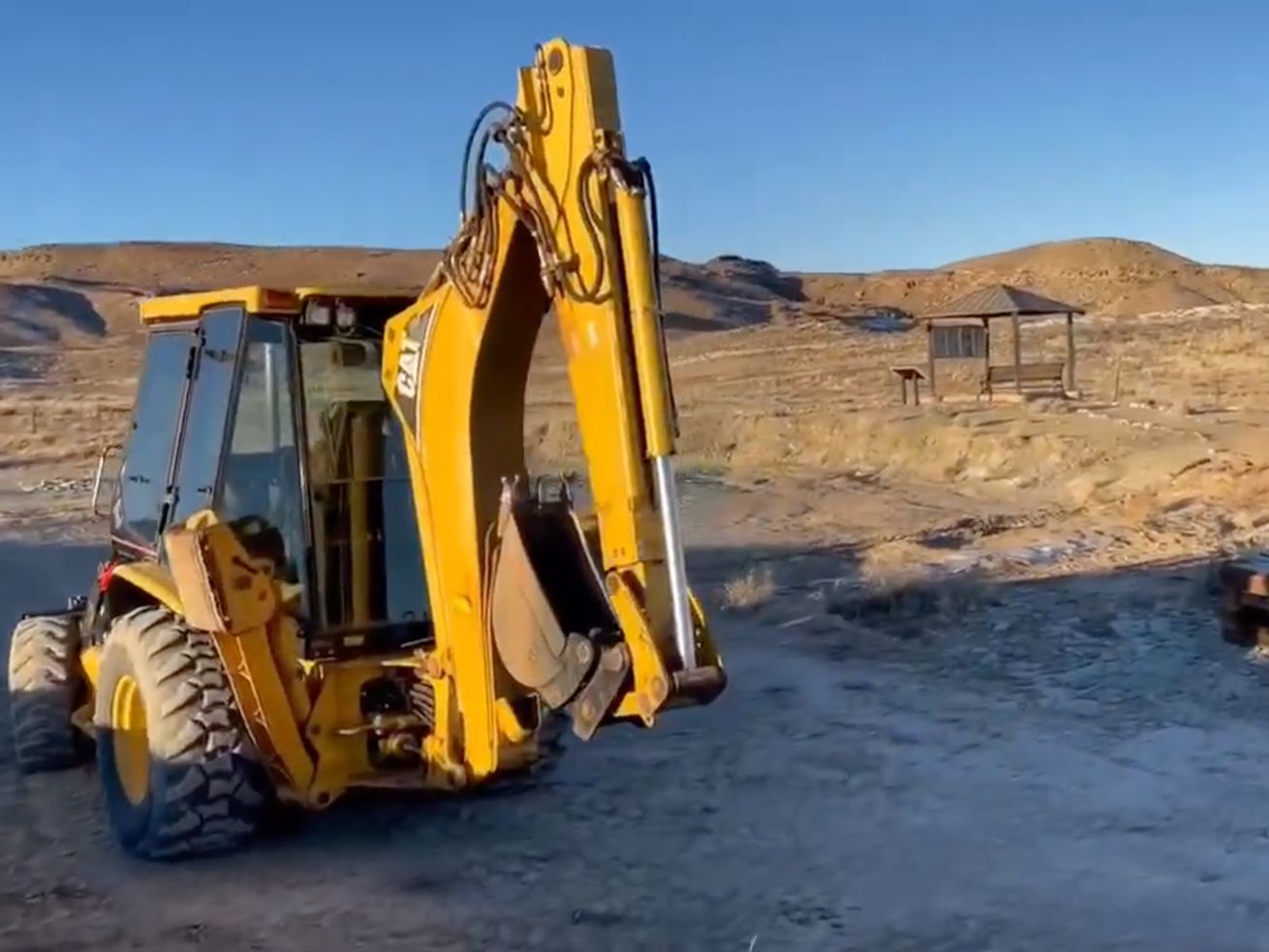 A screenshot from a video given to the Deseret News by the Utah Friends of Paleontology shows a backhoe and the torn-up boardwalk in Mill Canyon outside of Moab.