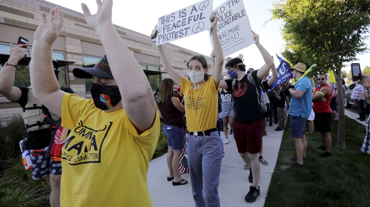 Protesters against police brutality gather outside of the Cottonwood Heights Police Department in Cottonwood Heights on Aug. 3, 2020. Three bills aimed at reforming how law enforcement handles use-of-force incidents and mental health calls are making their way through the Utah Legislature.