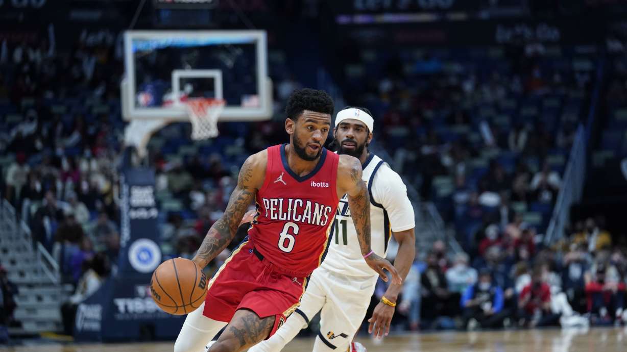 Nickeil Alexander-Walker (6) drives to the basket ahead of Utah Jazz guard Mike Conley (11) in the first half of an NBA basketball game in New Orleans, Monday, Jan. 3, 2022. Alexander-Walker was traded to the Jazz on Wednesday.