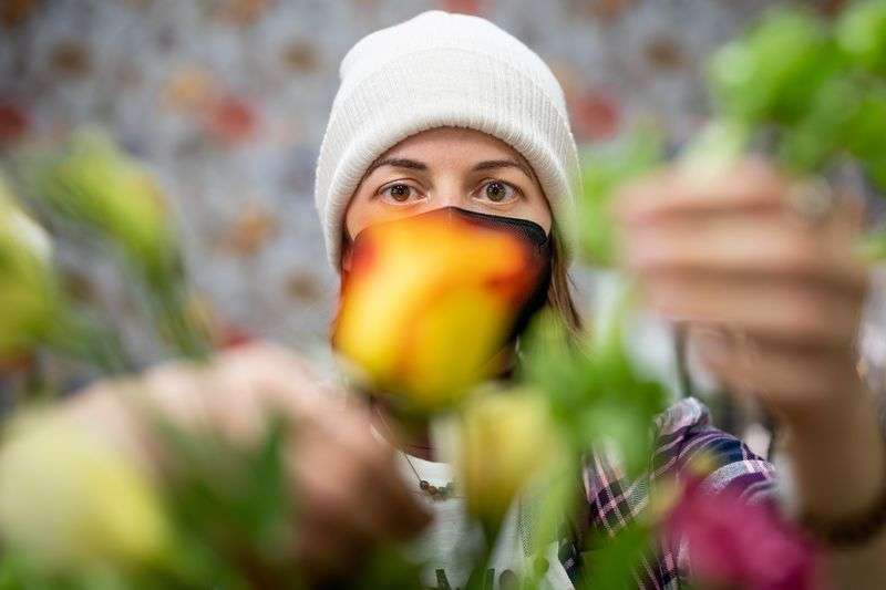 Floral designer Abbie Drage works on a flower
arrangement at Brown Floral in Holladay on Tuesday.