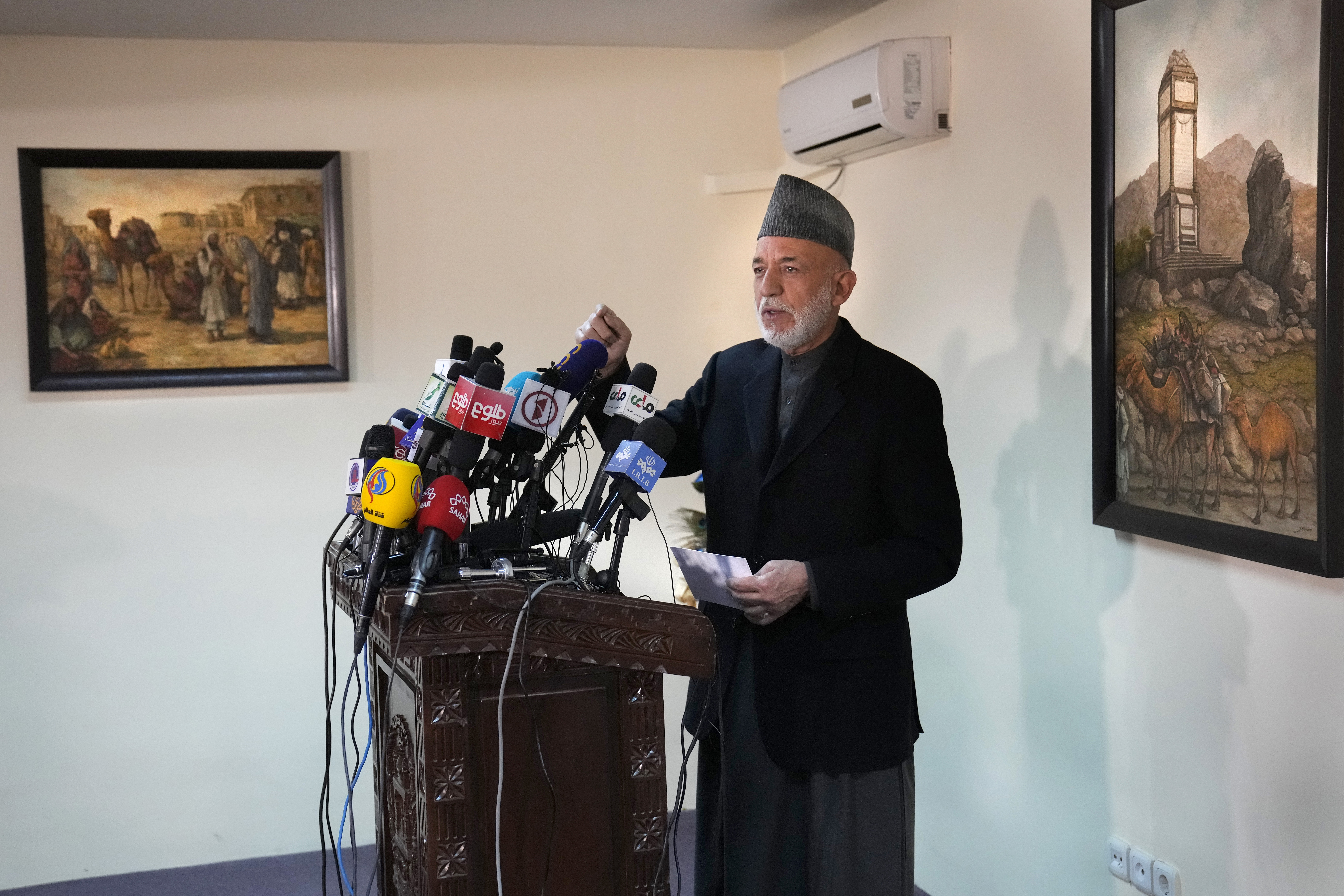 Afghanistan's former President Hamid Karzai, speaks during a press conference, in Kabul, Afghanistan, Sunday. Karzai called a White House order freeing $3.5 billion in Afghan assets for America's 9/11 families "an atrocity against the Afghan people." 