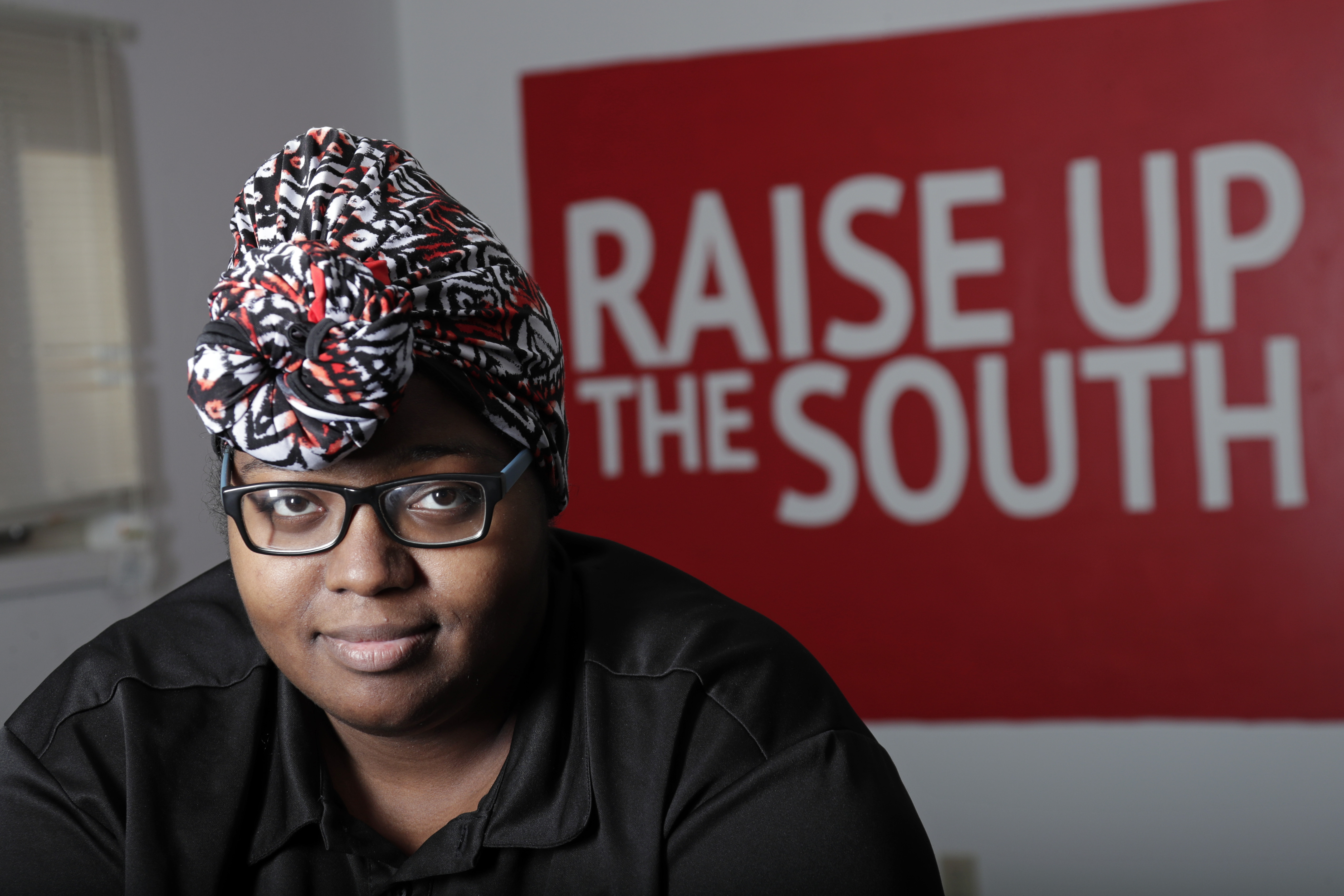 Food service worker Sheree Allen poses in the Raise Up offices, a branch of the Fight for $15 union, on Thursday in Durham, N.C. After decades of decline, U.S. unions have a new reason for hope: younger workers. Sheree Allen was hoping for benefits when she joined the food service company Chartwells last August.