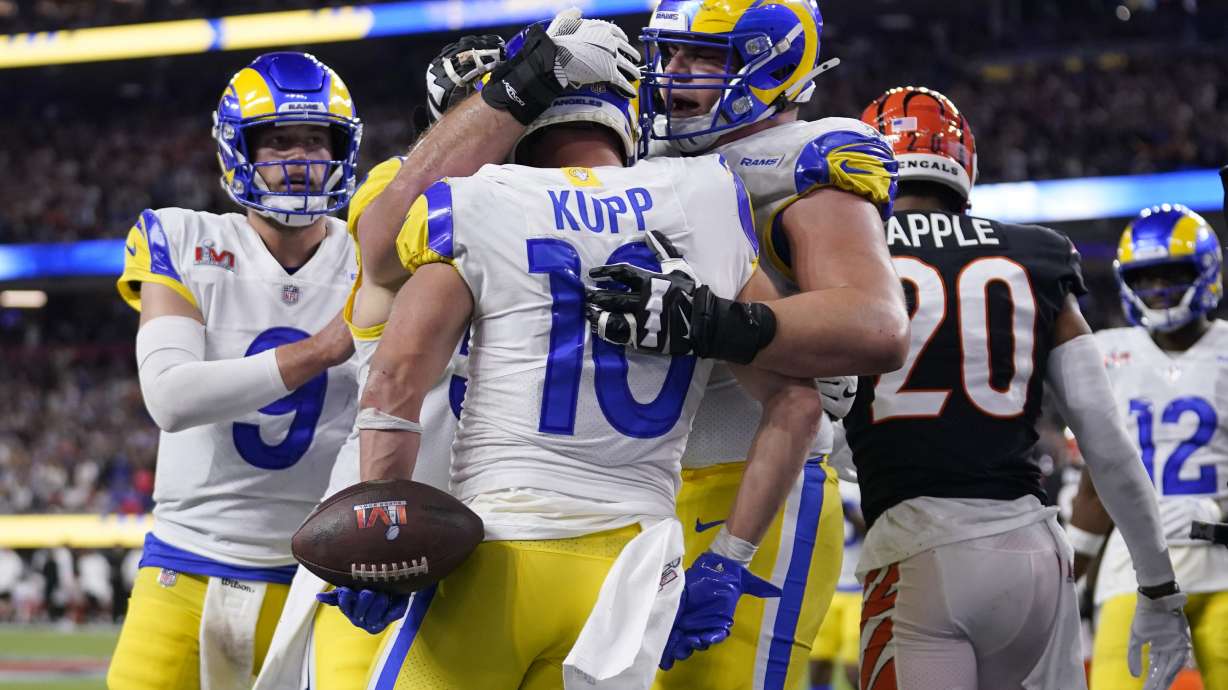 Los Angeles Rams wide receiver Cooper Kupp (10) is congratulated by teammates after scoring a touchdown against the Cincinnati Bengals during the second half of the NFL Super Bowl 56 football game Sunday, Feb. 13, 2022, in Inglewood, Calif.