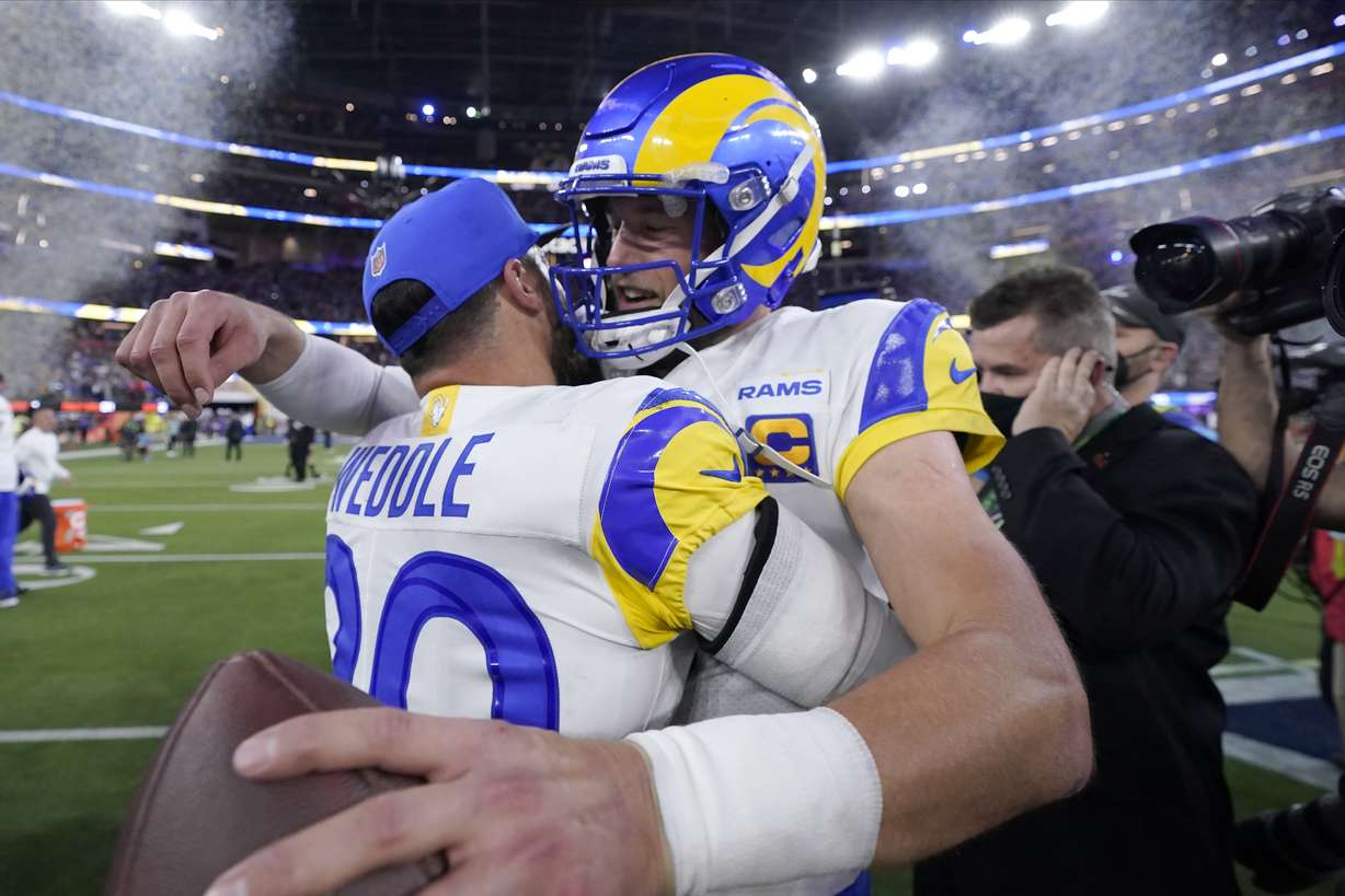 Los Angeles Rams quarterback Matthew Stafford, right, celebrates with defensive back Eric Weddle after the Rams defeated the Cincinnati Bengals in the NFL Super Bowl 56 football game Sunday, Feb. 13, 2022, in Inglewood, Calif.