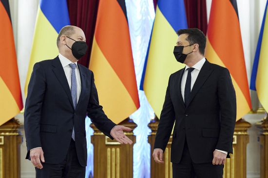 Ukrainian President Volodymyr Zelenskyy, right, listens to German chancellor Olaf Scholz while posing for a photo during their meeting at The Mariinskyi Palace in Kyiv, Ukraine, Monday. German Chancellor Olaf Scholz visited Ukraine as part of a flurry of Western diplomacy aimed at heading off a feared Russian invasion.