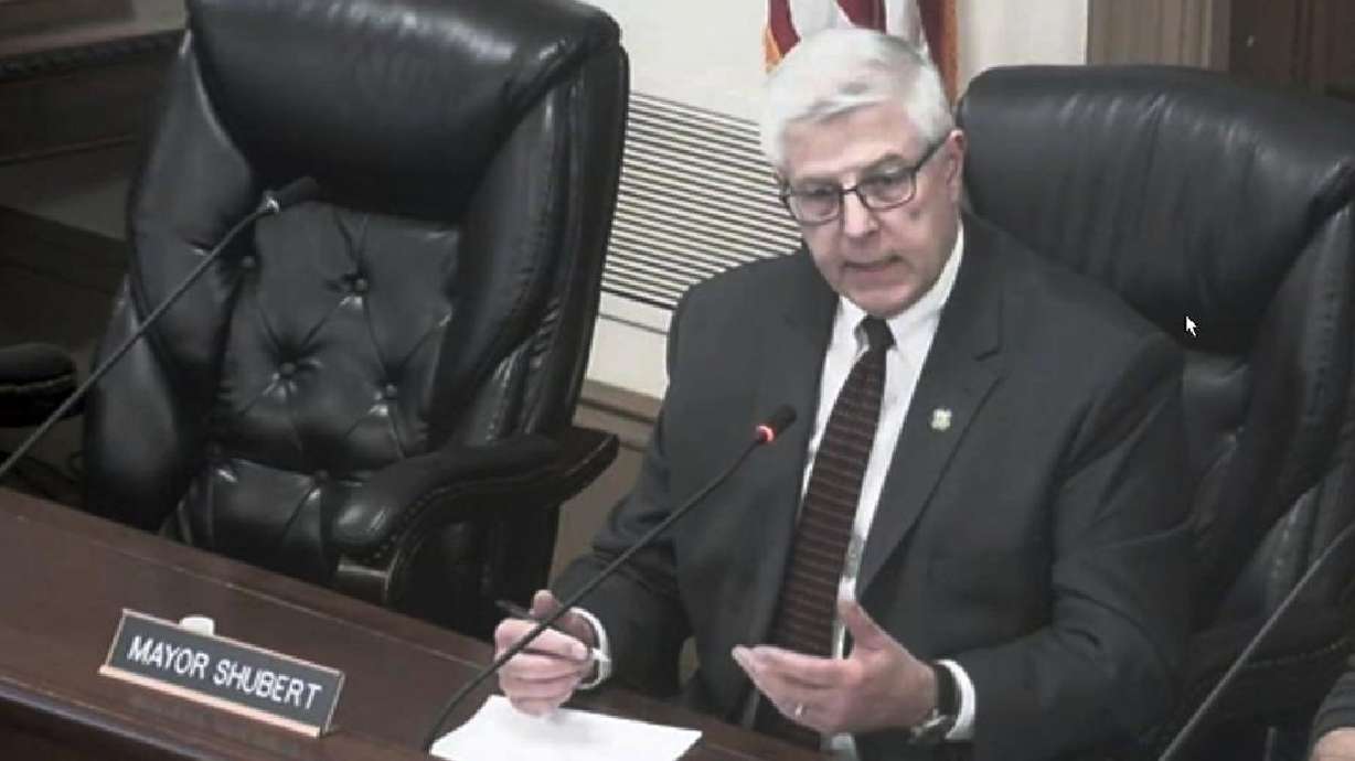 This image from a video shows Hudson, Ohio Mayor Craig Shubert in a city council meeting, Feb. 8, 2022 in Hudson, Ohio. Shubert, who had suggested allowing ice fishing shanties on a lake could lead to prostitution, has resigned. Shubert said he was stepping down Monday.