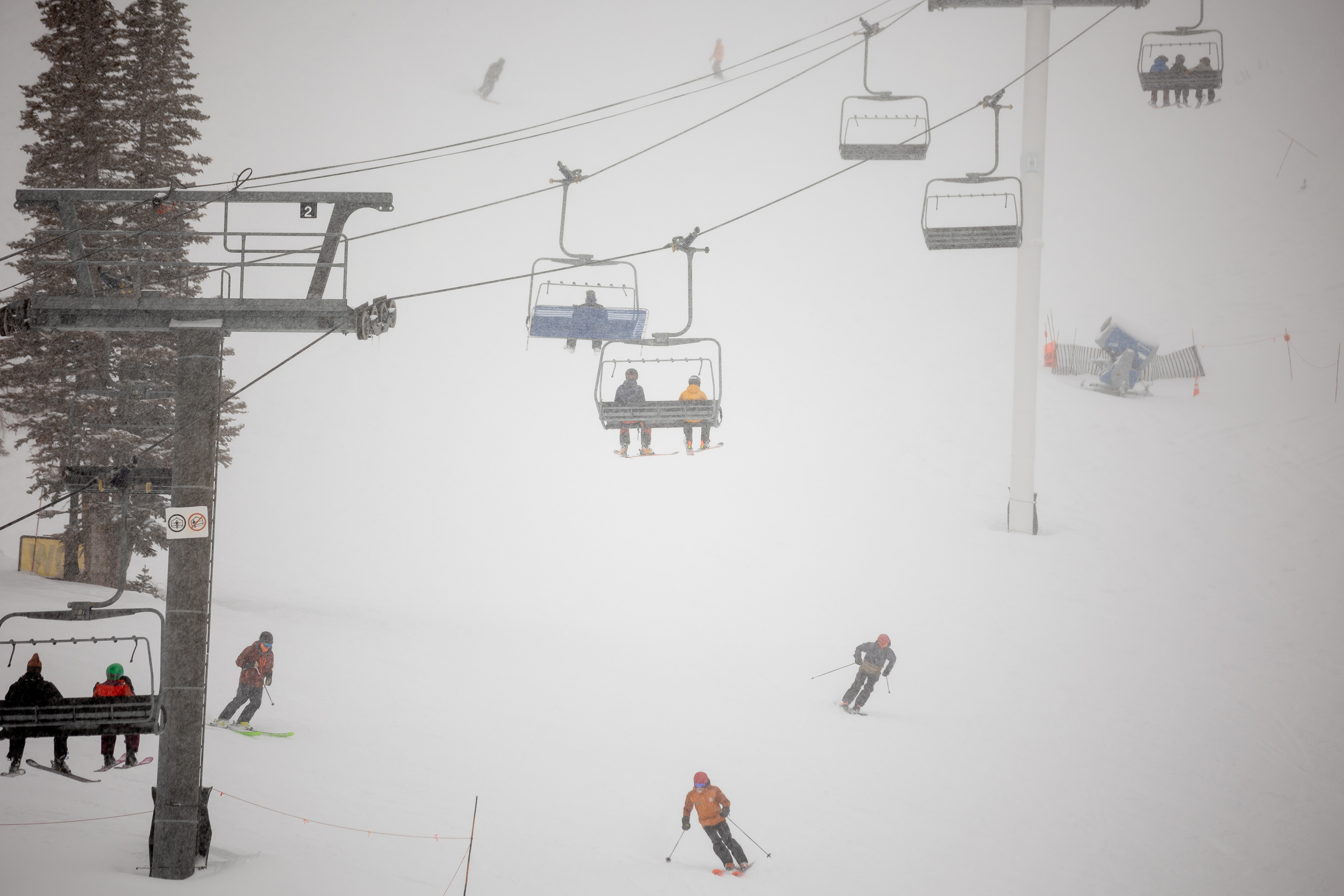 Fresh snow falls on skiers at Alta Ski Area on Dec. 9, 2021. A 14-year-old boy died Sunday after colliding with another skier at the resort.