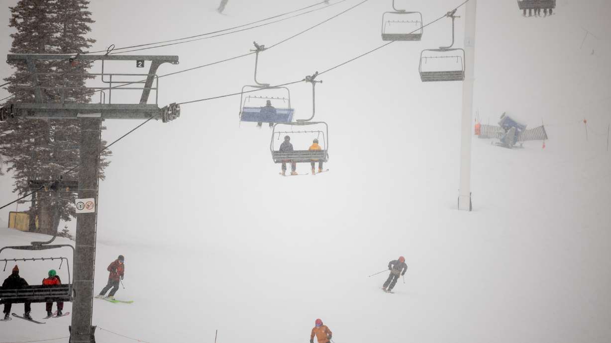 Fresh snow falls on skiers at Alta Ski Area on Dec. 9, 2021. A 14-year-old boy died Sunday after colliding with another skier at the resort.