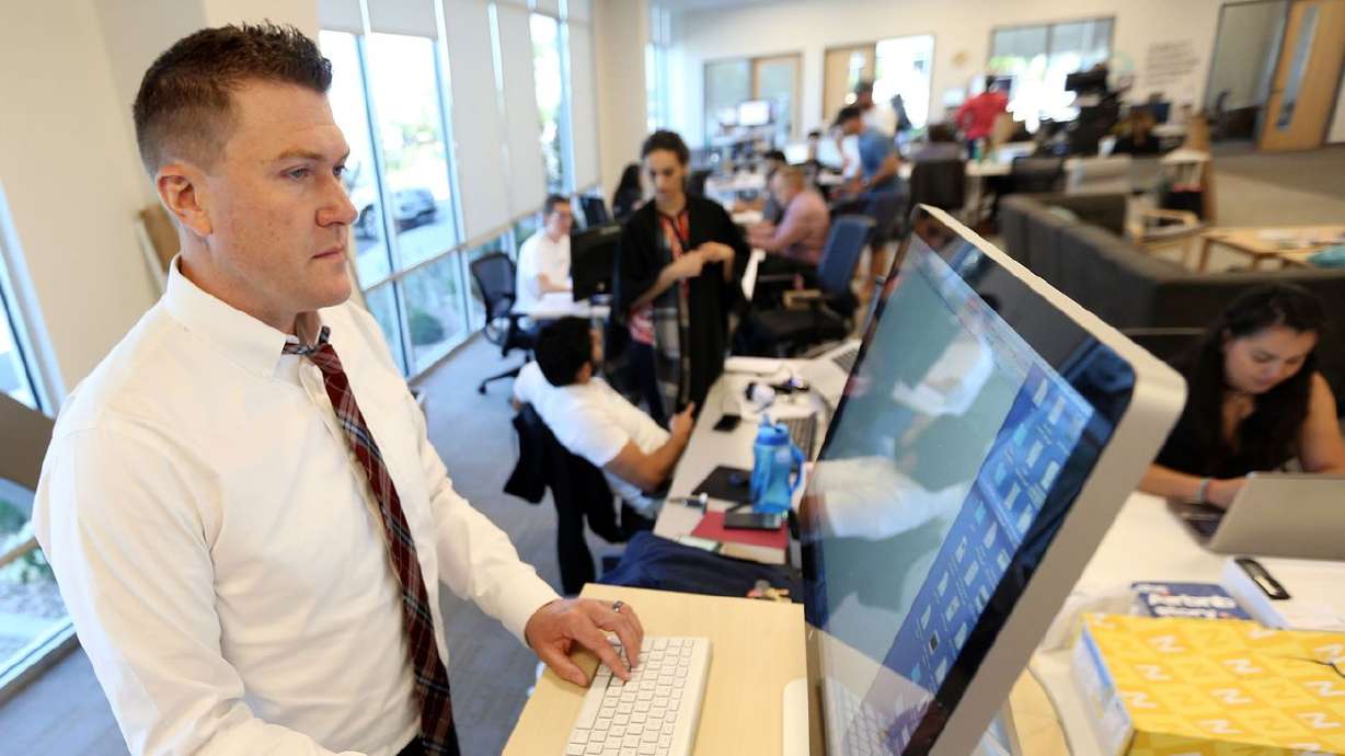 Johnny Hanna, CEO and co-founder of Homie, works at the company’s headquarters in Draper on June 7, 2017.