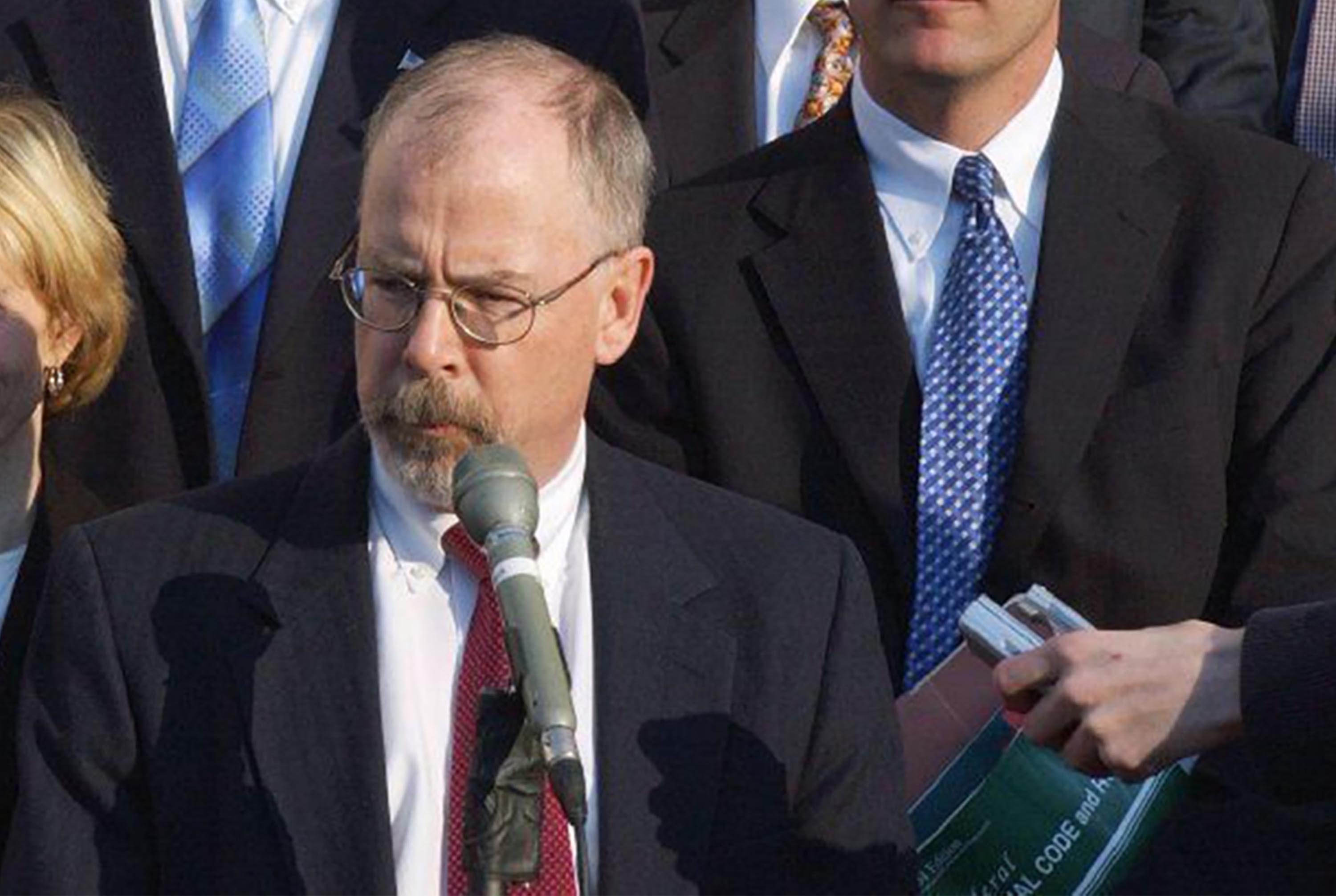 U.S. Attorney John Durham, center, is seen outside federal court in New Haven, Conn., in Feb, 2021. Durham is acting as special counsel in the investigation of the origins of the Trump-Russia inquiry.