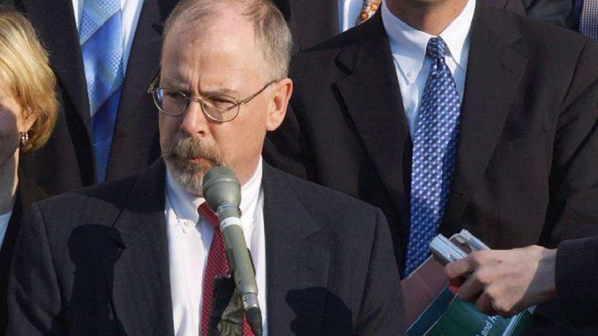 U.S. Attorney John Durham, center, is seen outside federal court in New Haven, Conn., in Feb, 2021. Durham is acting as special counsel in the investigation of the origins of the Trump-Russia inquiry.