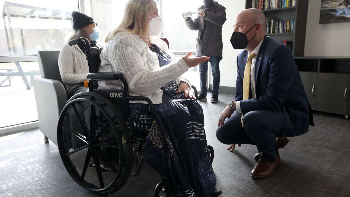 Alma Bennett, Pamela’s Place resident, talks to Gov. Spencer Cox at a press conference held to encourage Utahns to donate to the Pamela Atkinson Homeless Trust Fund at Pamela’s Place Apartments in Salt Lake City on Tuesday.
