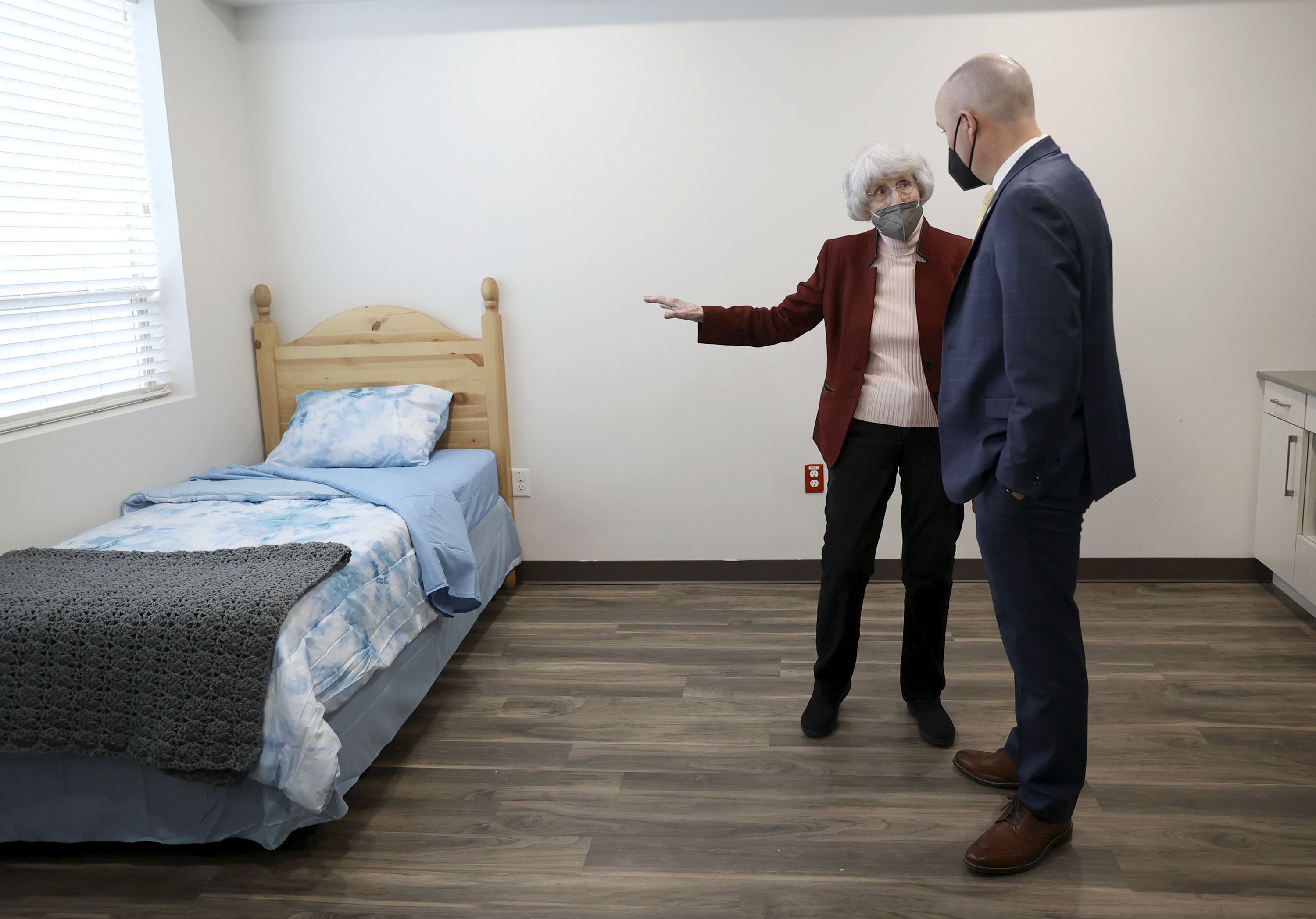 Pamela Atkinson and Gov. Spencer Cox look at a Pamela’s Place Apartments studio during a press conference held to encourage Utahns to donate to the Pamela Atkinson Homeless Trust Fund in Salt Lake City on Tuesday.