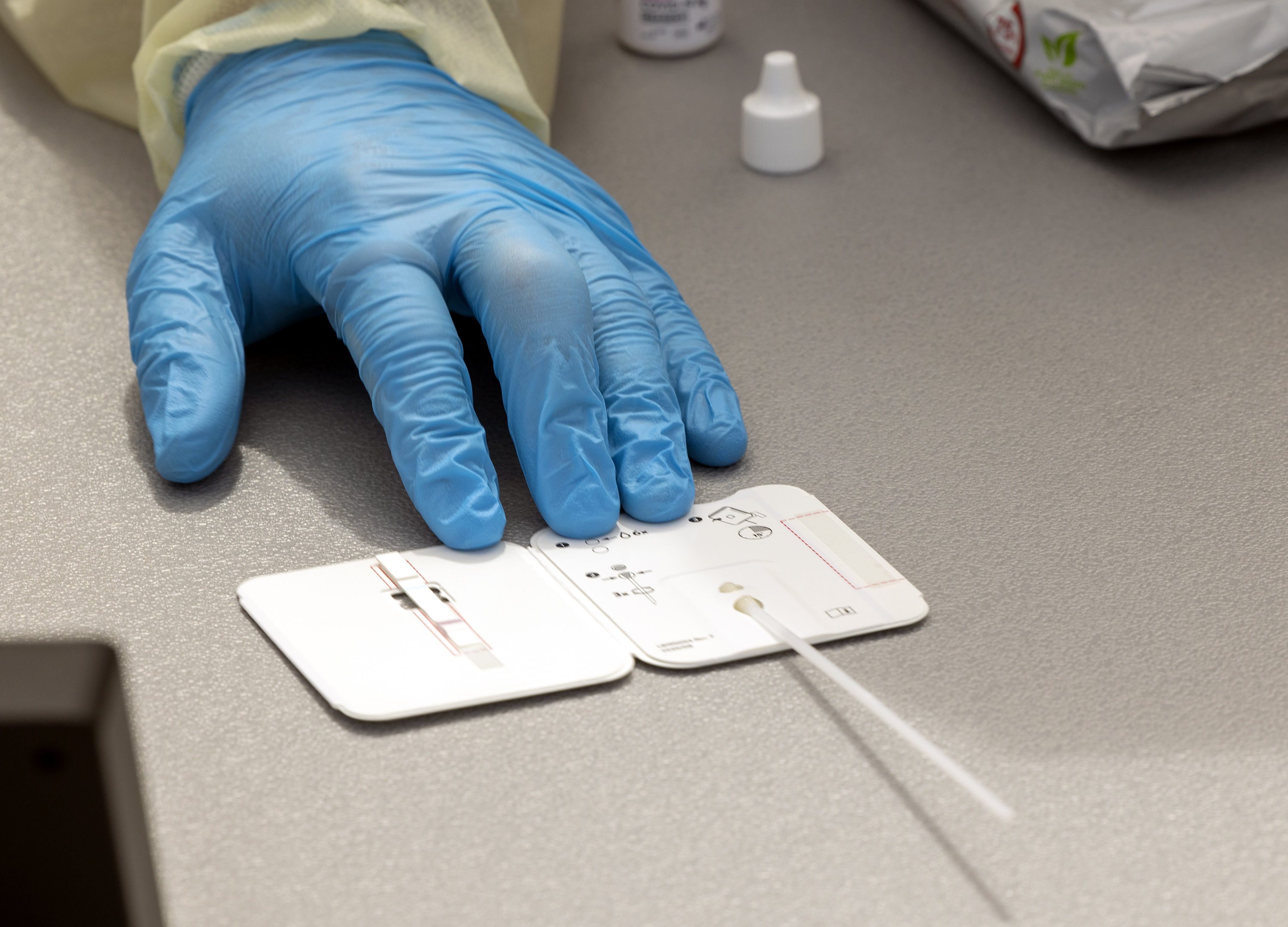 A worker holds a rapid COVID-19 antigen test on a table at a testing site in Sandy on Aug. 2, 2021. A new University of Utah Health study published on Feb. 7 found women who test positive for COVID-19 have a higher risk of pregnancy complications.