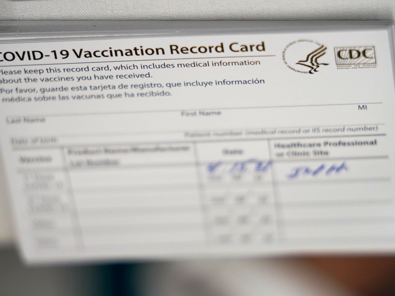 A stack of COVID-19 vaccination record cards are shown at Jackson Memorial hospital on April 15, 2021, in Miami. A Utah House committee advanced a bill that would prohibit discrimination based on immunity status.