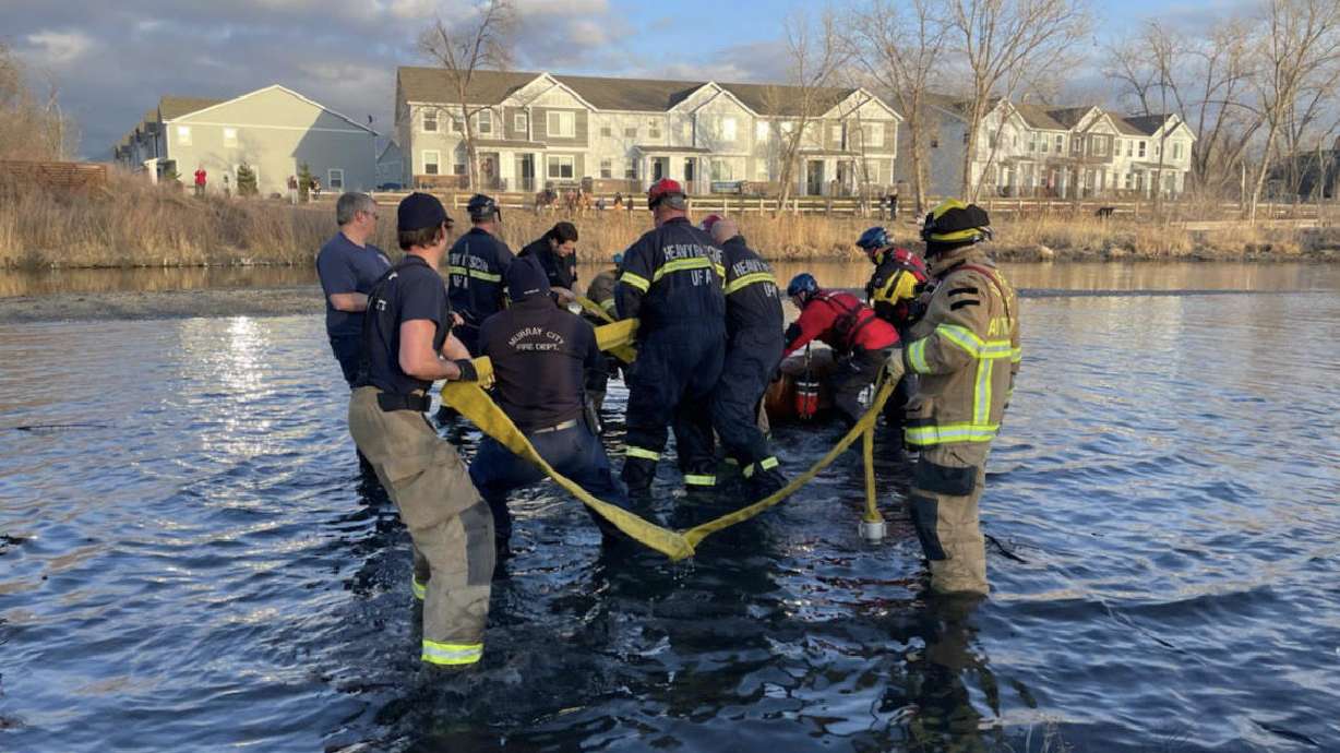 Fire crews from the Murray City Fire Department and Unified Fire Authority work together to rescue a horse from Jordan River near 700 West and 4800 South in Murray on Tuesday. The animal got stuck in the muddy riverbed when its rider attempted to cross the river with the animal.