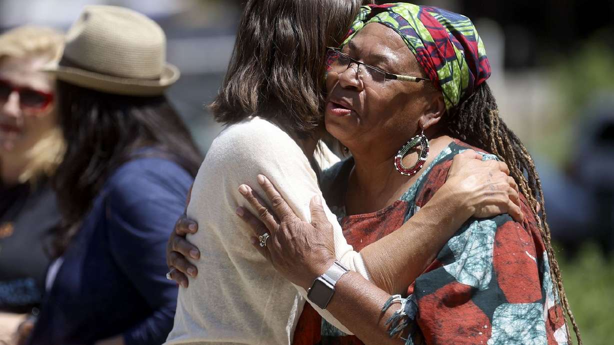 Salt Lake City Mayor Erin Mendenhall hugs Betty Sawyer, Project Success Coalition and Utah Juneteenth Freedom and Heritage Festival executive director, after a Juneteenth flag-raising ceremony outside of the City-County Building in Salt Lake City on June 18, 2021.