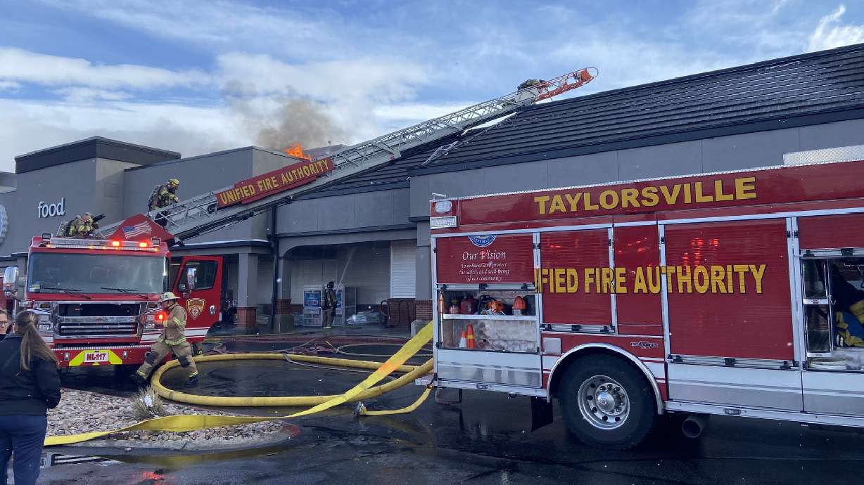 Shoppers were evacuated from the Macey's grocery store at 1825 W. 4700 South in Taylorsville on Wednesday after the roof of the building caught fire.