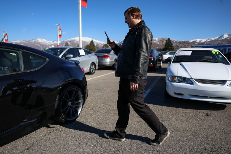 Sales professional Jared Barnes makes a video of a used
2009 Scion FR-S for an interested customer at Performance Toyota
Bountiful in Bountiful on Friday, Feb. 11.