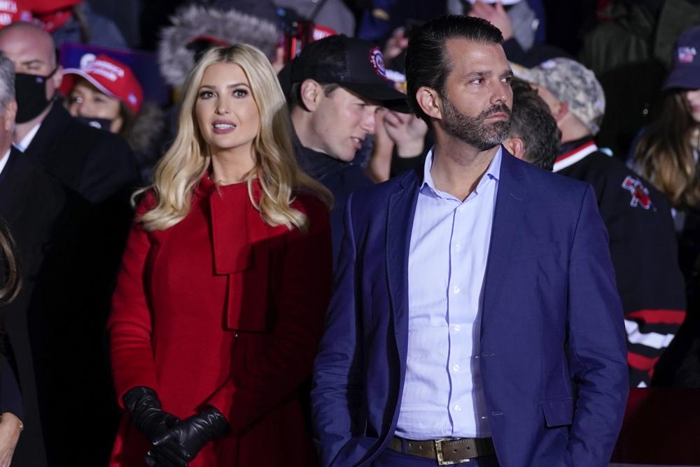 Ivanka Trump and Donald Trump Jr., listen as President Donald Trump speaks during a campaign rally at Kenosha Regional Airport, Monday, Nov. 2, 2020, in Kenosha, Wis. A judge is hearing arguments Thursday in former president Donald Trump's fight to avoid being questioned under oath in a New York investigation into his business practices.