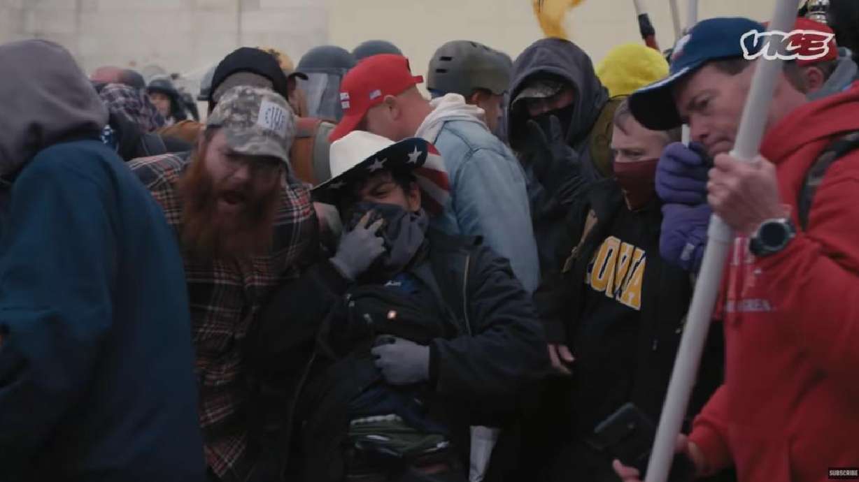 A man with a gun is pictured outside the U.S. Capitol in Washington during on Jan. 6, 2021, in a video published by VICE News. Is it Salt Lake resident John Banuelos, a man who fatally stabbed another man in Liberty Park six months later?