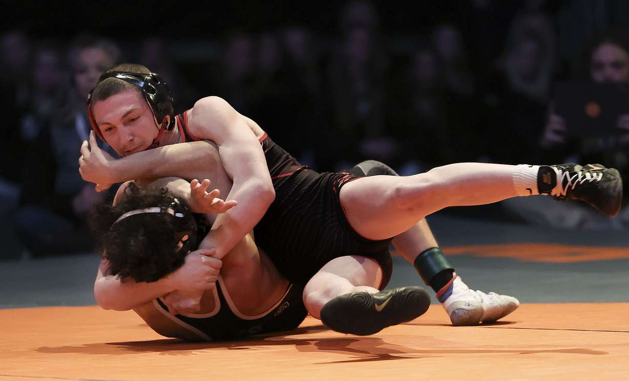 Michael Alexander of Uintah High takes down Aaron Garcia of Payson in the 113-pound weight class during the 5A wrestling state championship at UVU in Orem on Thursday, Feb. 17, 2022. Alexander pinned Garcia in 22 seconds.