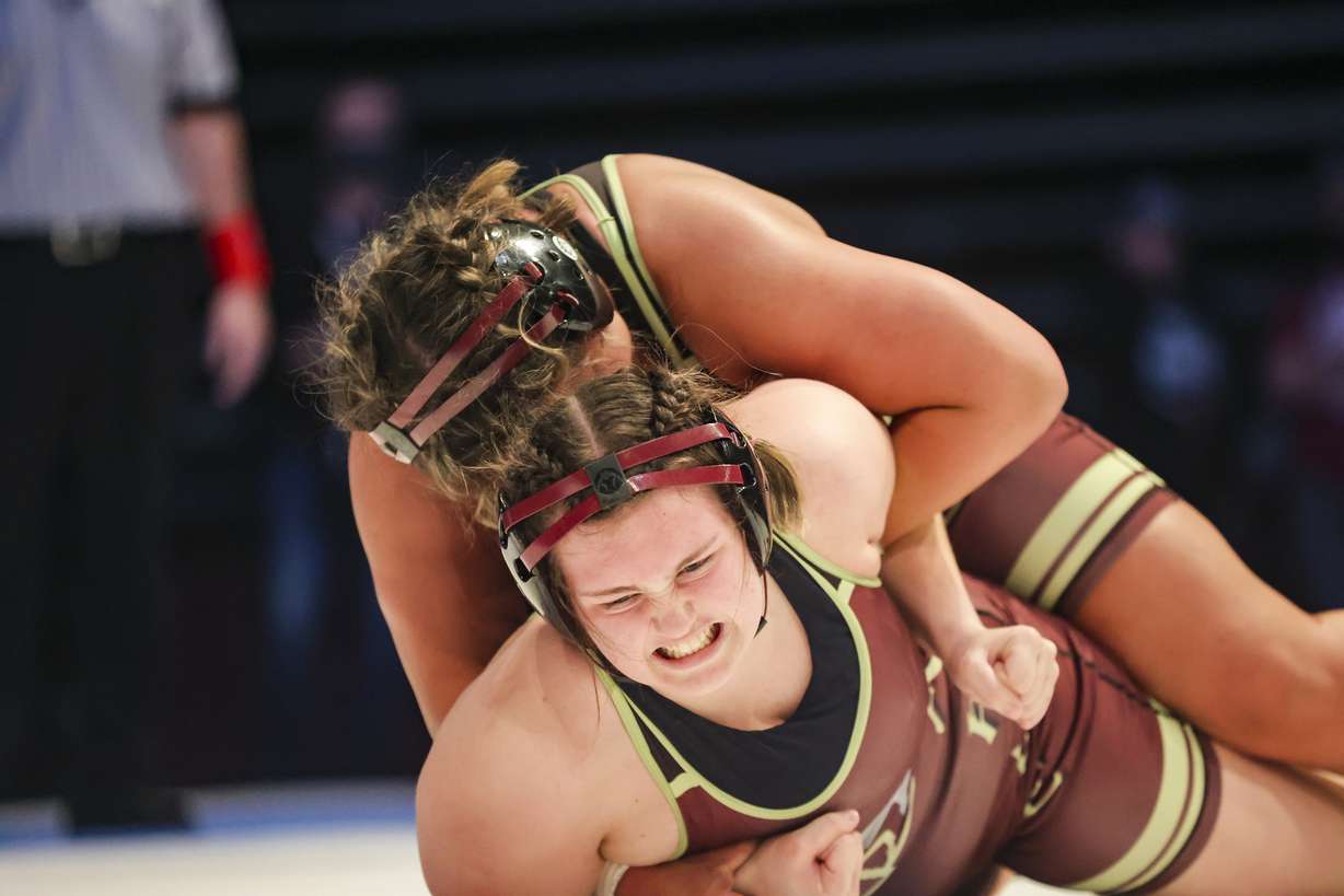 Nya Seiuli of Maple Mountain, top, beats Aurellia Ramos of Maple Mountain in the 190-pound finals match at the 5A wrestling state championship at UCCU Center in Orem on Thursday, Feb. 17, 2022.