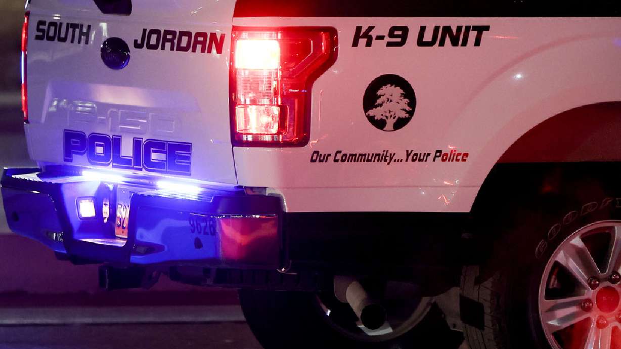 A West Jordan woman was arrested Sunday and accused of shooting her husband in the shoulder and then trying to shoot him in the head.