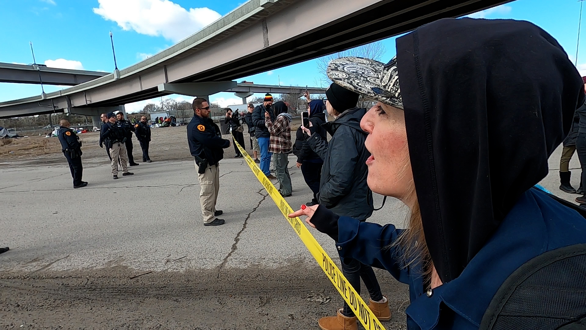 Barbarella Roller, an advocate for people experiencing homelessness, watches as authorities clear an encampment at 546 S. 700 West in Salt Lake City Thursday.