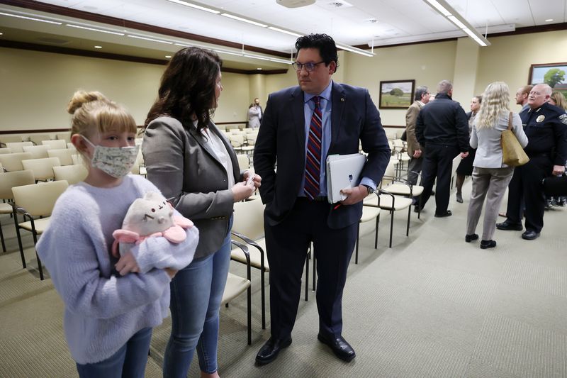 Rep. Ryan Wilcox, R-Ogden, talks with Tiffany James,
mother of Zane James, who was shot by police and later died.
Tiffany James spoke in opposition to Wilcox’s HB399, Government
Record Amendments, in the House Law Enforcement and Criminal
Justice Committee meeting at the Capitol on Friday.