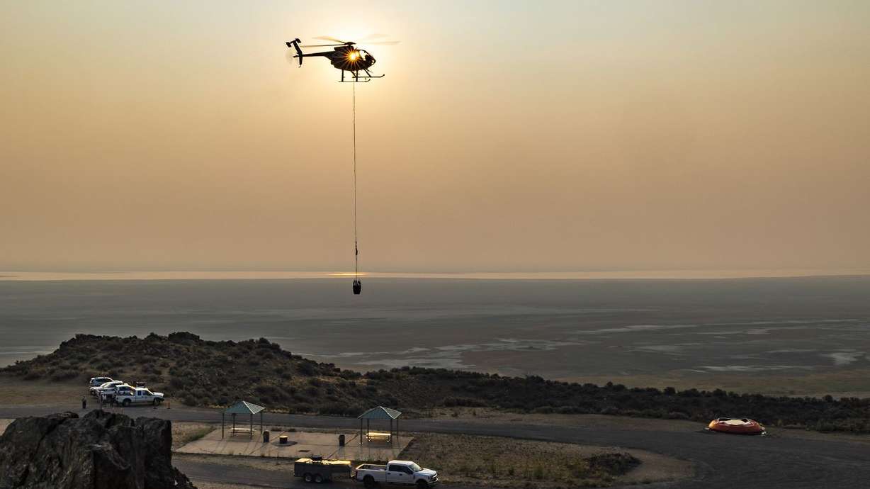 A helicopter dips water to fill six remote guzzlers at Antelope Island State Park for the island’s bighorn sheep on Aug. 16, 2021. Voters in eight Mountain West states say a politician’s stance on environmental issues is just as important as the economy,
health care and education come Election Day, according to Colorado College’s annual State of the Rockies Project.