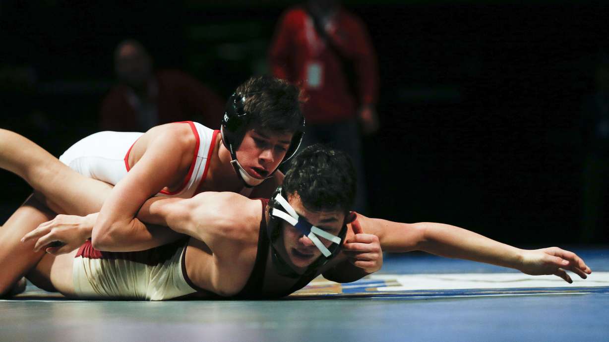 Mountain Ridge’s Kyison Garcia and Mountain View’s Cody Burr compete in the 106-pound match in the state championships at Utah Valley University in Orem, Feb. 13, 2020.