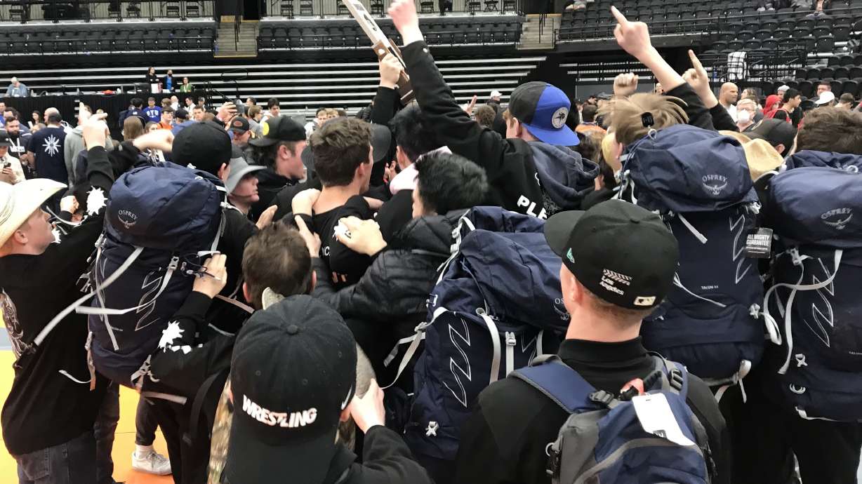Pleasant Grove celebrates its fifth-straight Class 6A state wrestling championship and 11th in 12 years, Saturday, Feb. 19, 2022 at the UCCU Center in Orem.
