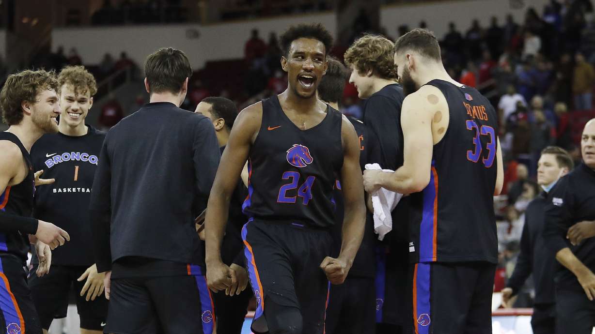 Boise State's Abu Kigab celebrates after a game tying basket against Fresno State's during the second half of an NCAA college basketball game in Fresno, Calif., Friday Jan. 28, 2022.