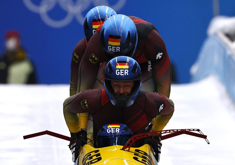 2022 Beijing Olympics - Bobsled - 4-man Heat 1 - National Sliding Centre, Beijing, China - February 19, 2022. Francesco Friedrich of Germany, Thorsten Margis of Germany, Candy Bauer of Germany and Alexander Schueller of Germany in action.
