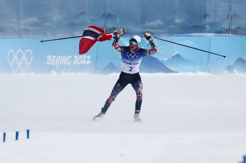 2022 Beijing Olympics - Cross-Country Skiing - Women's 30km Mass Start Free - National Cross-Country Centre, Zhangjiakou, China - February 20, 2022. Therese Johaug of Norway celebrates winning gold.