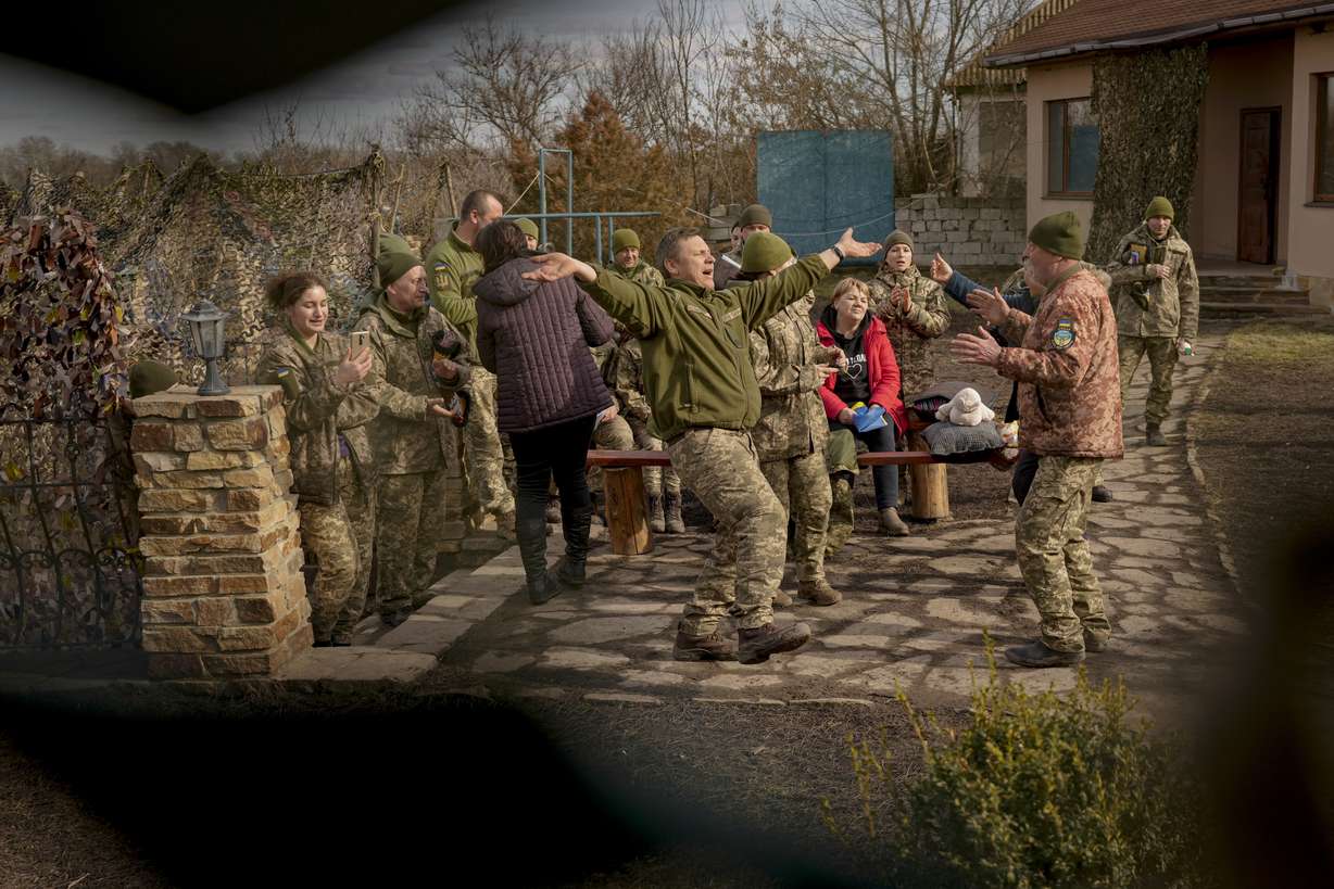 Larisa Borisenko, sings for Ukrainian servicemen with the 34th Battalion near the frontline village of Krymske, Luhansk region, in eastern Ukraine, Saturday. Ukrainian President Volodymyr Zelenskyy, facing a sharp spike in violence in and around territory held by Russia-backed rebels and increasingly dire warnings that Russia plans to invade, on Saturday called for Russian President Vladimir Putin to meet him and seek resolution to the crisis.