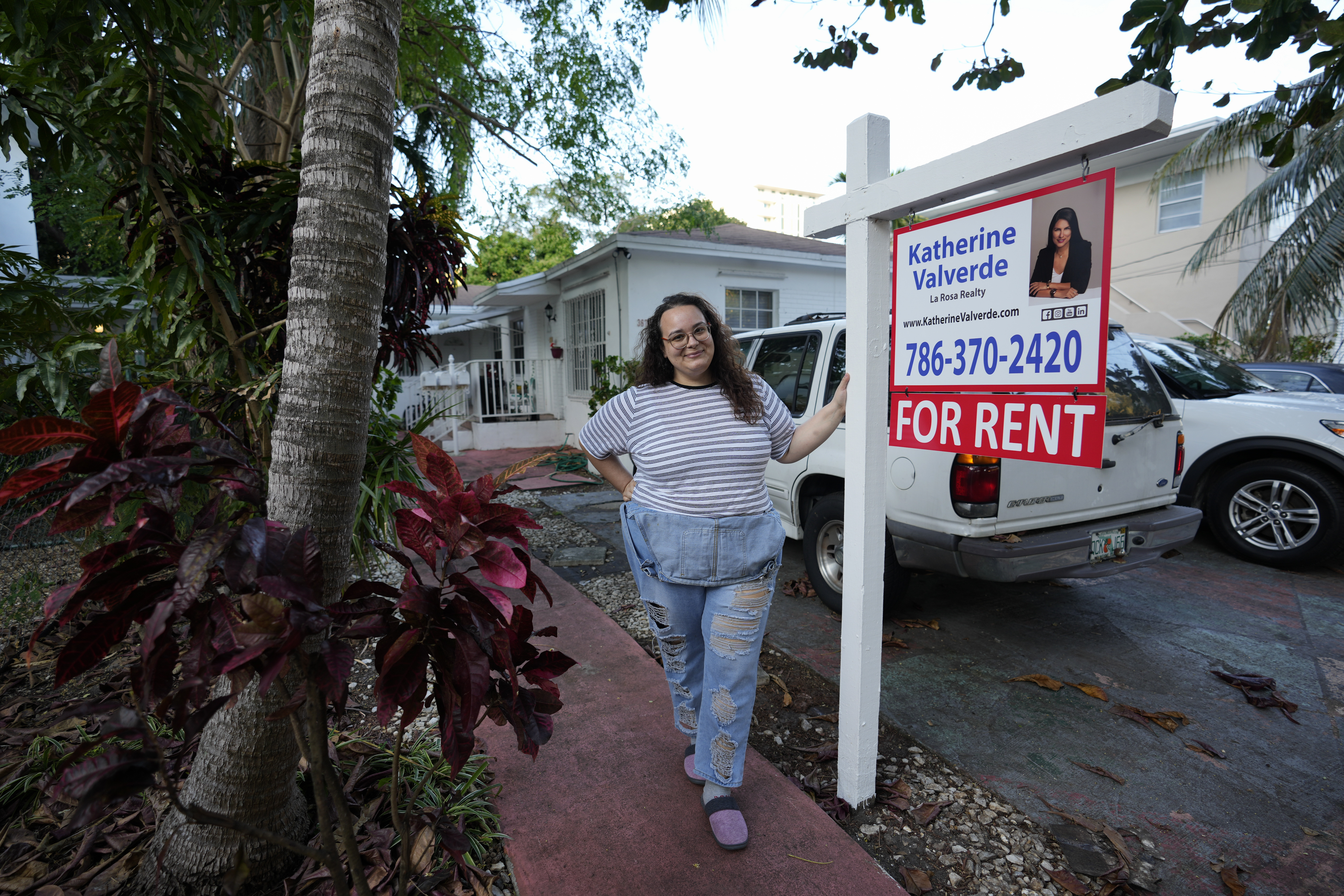 Krystal Guerra, 32, poses for a picture outside her apartment, which she has to leave after her new landlord gave her less than a month's notice that her rent would go up by 26%, Feb. 12, in the Coral Way neighborhood of Miami.