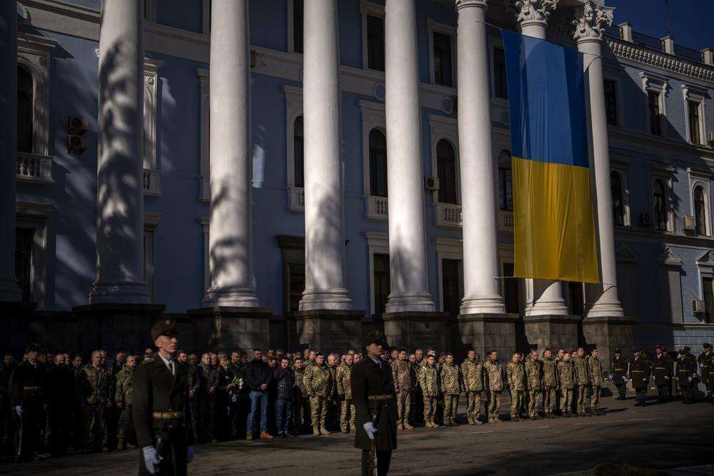 Military personnel attend the funeral of Ukrainian Army captain killed in eastern Ukraine Anton Sydorov, 35, Tuesday in Kyiv. Western leaders said Tuesday that Russian troops have moved into rebel-held areas in eastern Ukraine after President Vladimir Putin's recognized their independence — but some indicated it was not yet the long-feared full-fledged invasion as confusion reigns in the region.