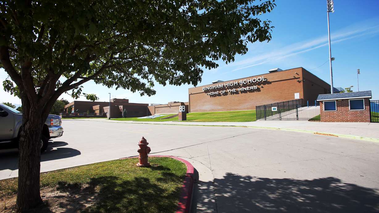 A wrestling coach at Bingham High School was arrested Friday and accused of unlawful sexual conduct with a student.