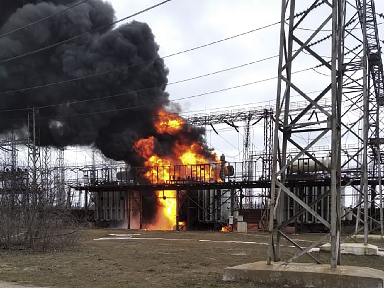 Flames and smoke rise from the thermal power plant, which, according to local authorities, was damaged by shelling, near the front line in the town of Shchastia in the Luhansk region, Ukraine, on Tuesday.