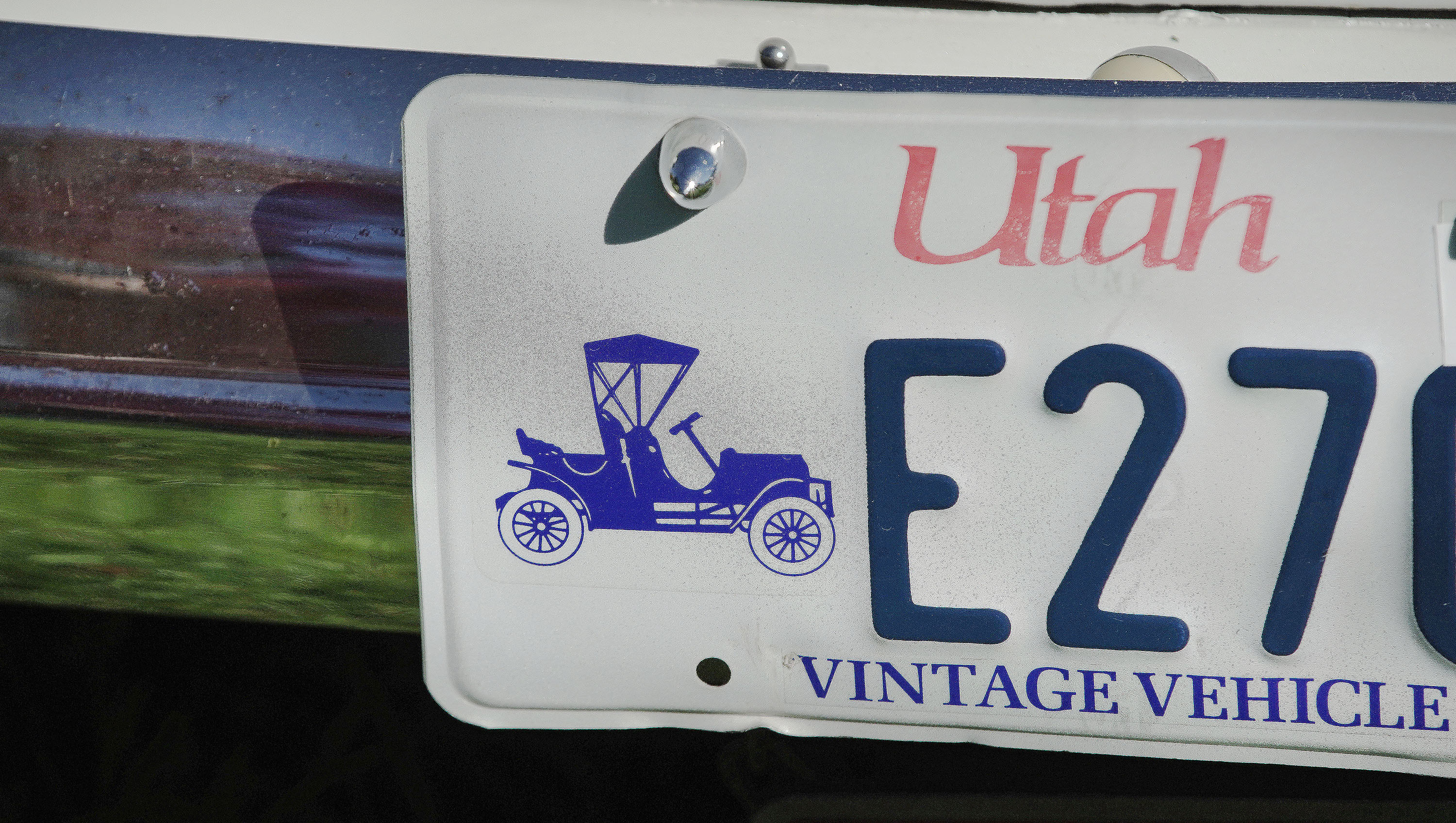 A vintage vehicle license plate is pictured during the Rumble in the Park car show at Pioneer Park in Salt Lake City on Sunday, June 13, 2021. A 2021 study on Utah’s license plate program notes that of the 74 special license plates currently in circulation, 19 receive no revenue at all.