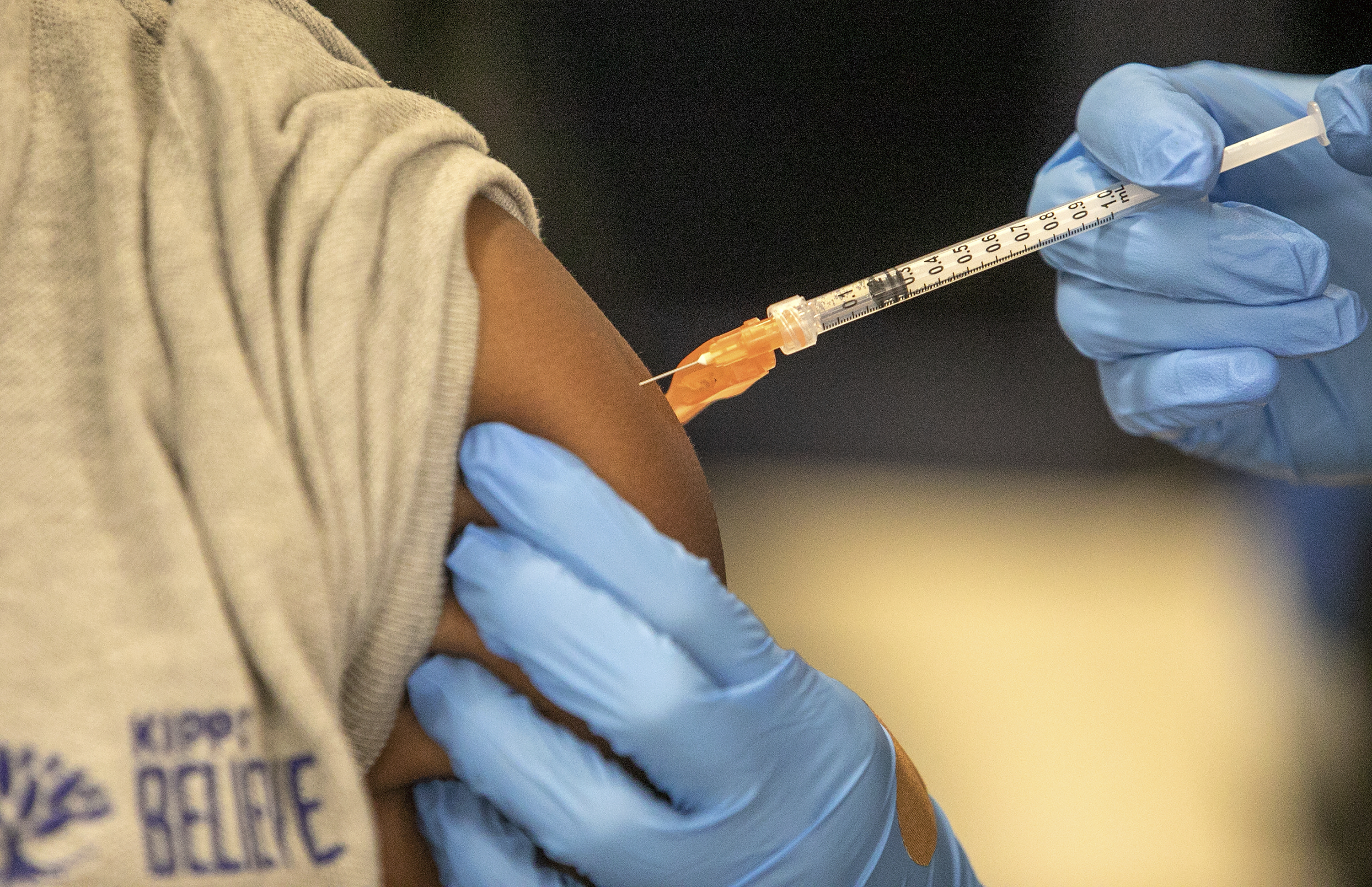 Medical personnel vaccinate students at a school in New Orleans on Jan. 25. U.S. data suggests it is unlikely that COVID-19 vaccines might trigger a rare inflammatory condition linked with the virus in children, according to a study published Tuesday. 