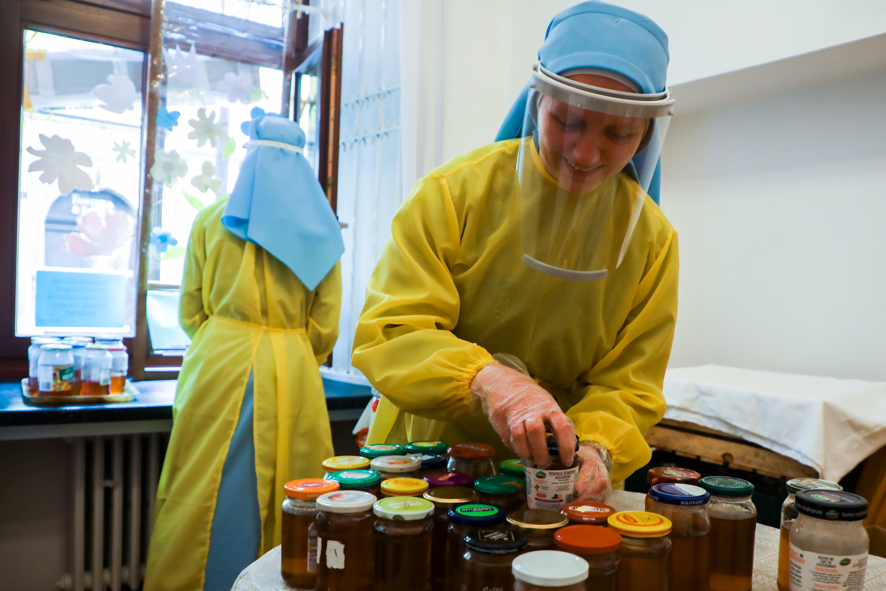 Sisters Canonesses of the Holy Spirit distribute food to the poor and homeless during the COVID-19 pandemic in Krakow, Poland, on April 10, 2020.